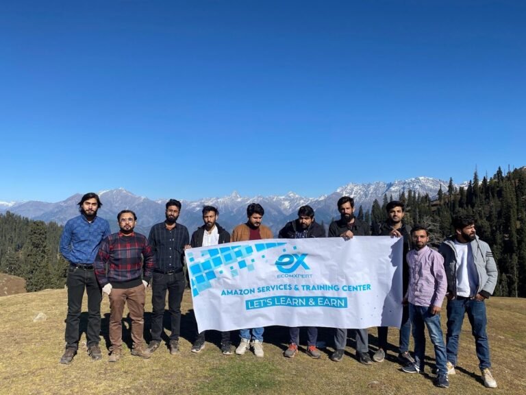 EcomXpert students and team on a group trip with the EcomXpert banner